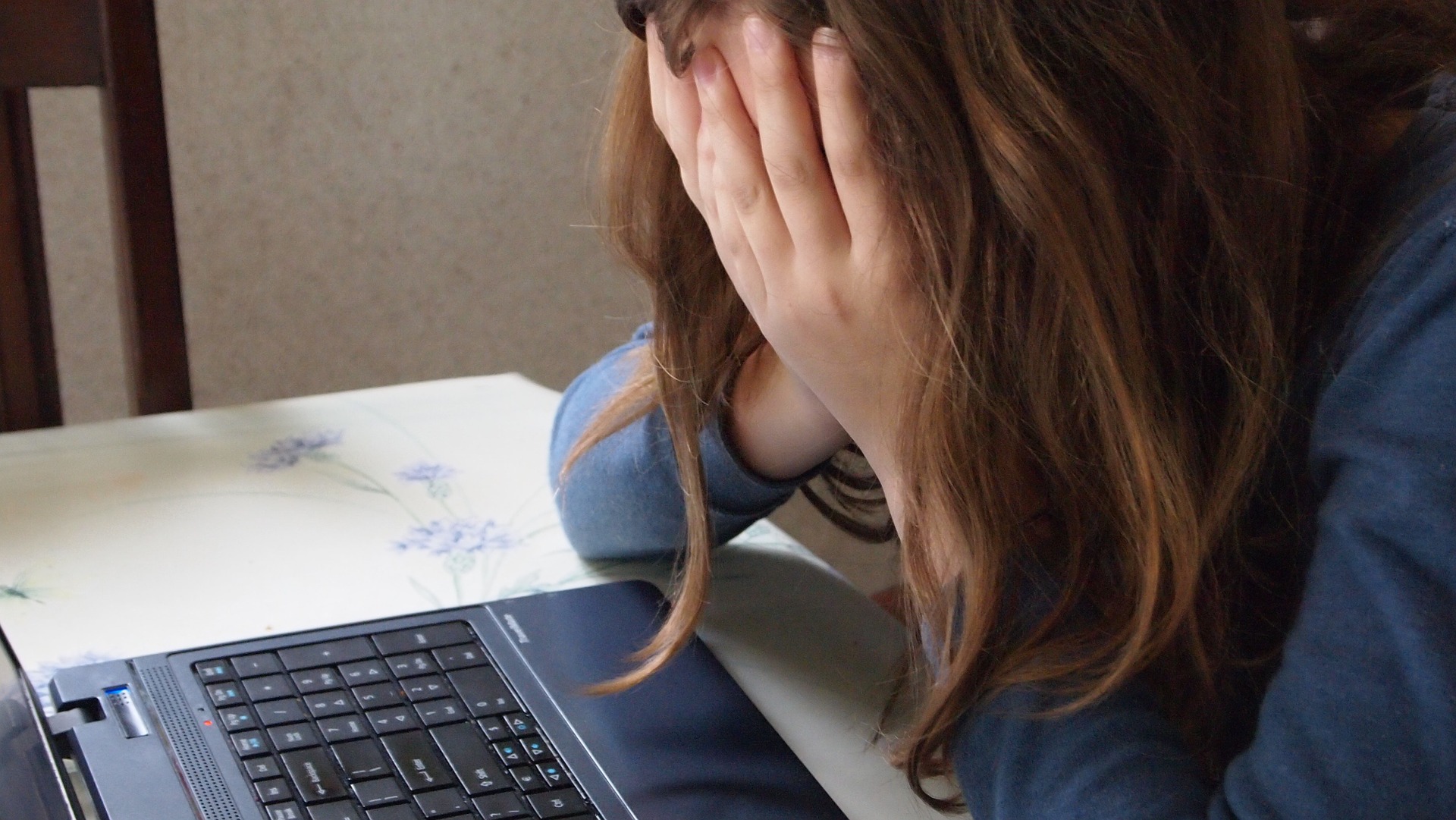 Unemployed woman upset at her computer